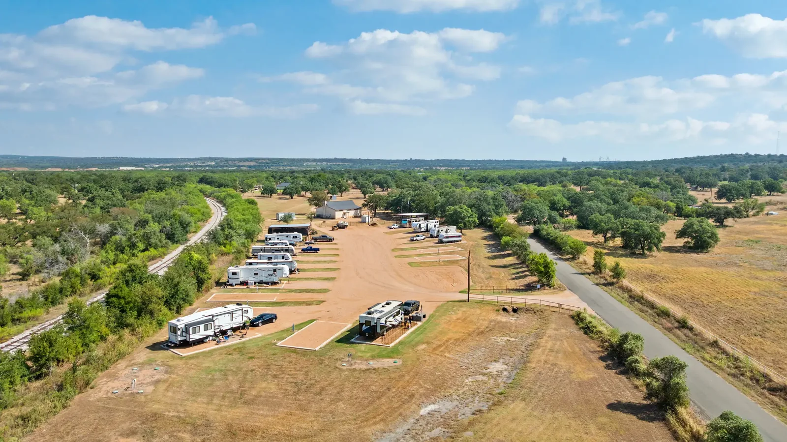 Aerial view of Snowbird Landing RV Park among the trees in Marble Falls, Texas